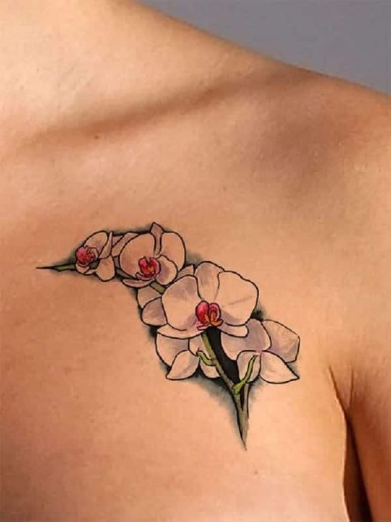 tatuaje orquidea clavicula