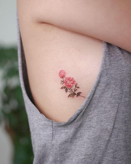 tatuajes costilla flor
